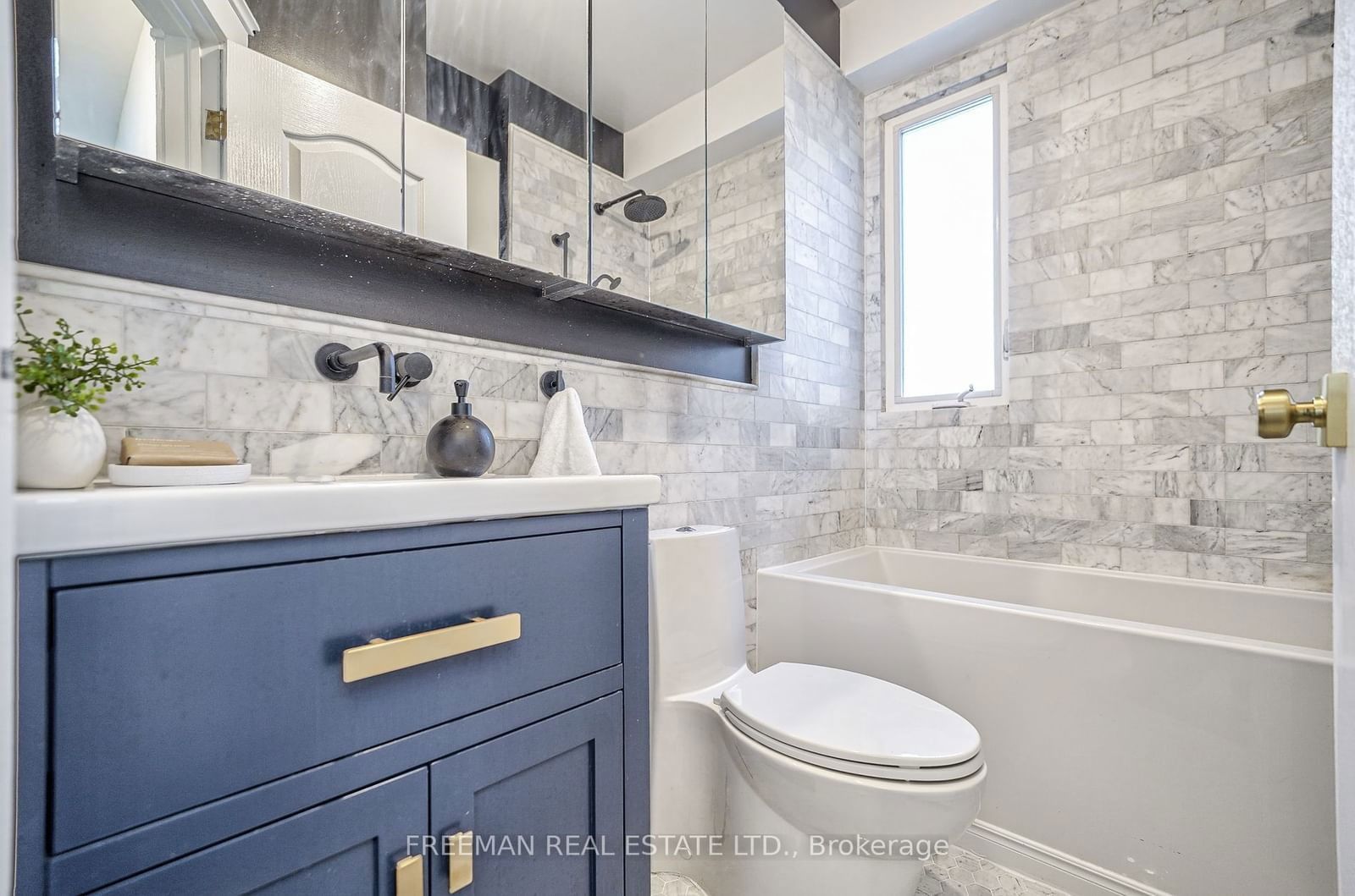 Image may contain Indoors Interior Design Sink Sink Faucet Bathing Bathtub Person Tub Plant Bathroom and Room