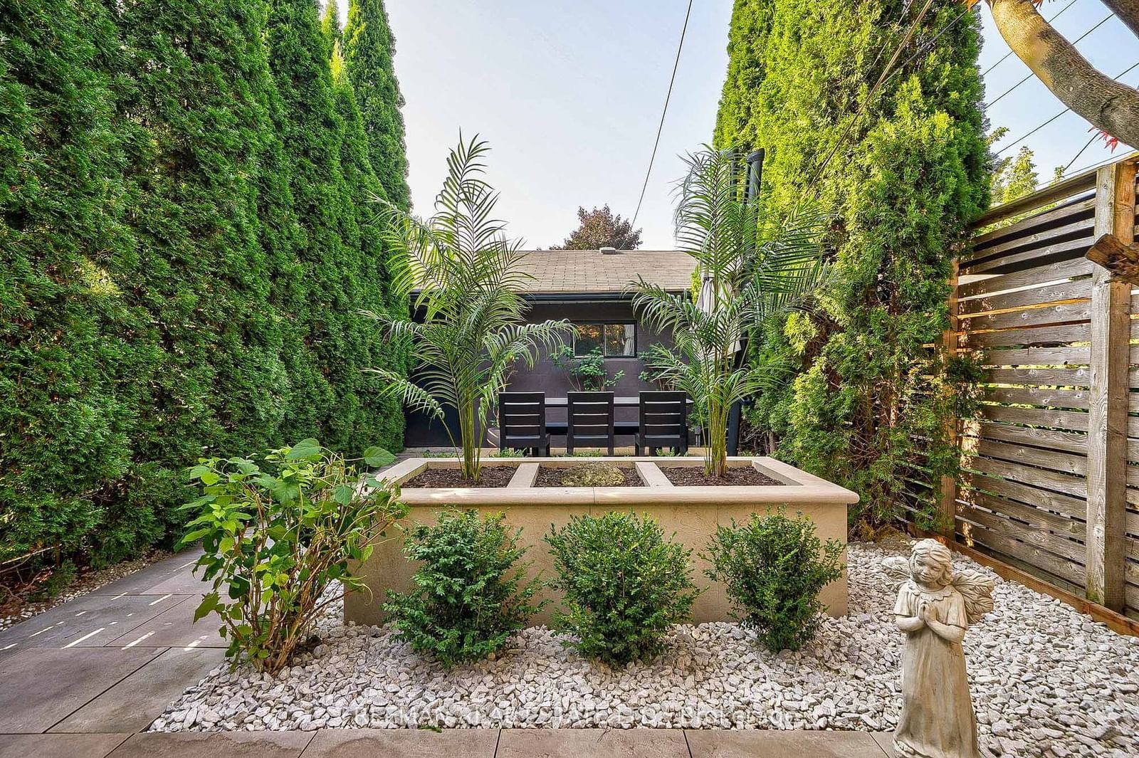 Image may contain Backyard Nature Outdoors Yard Garden Indoors Interior Design Chair Furniture and Person