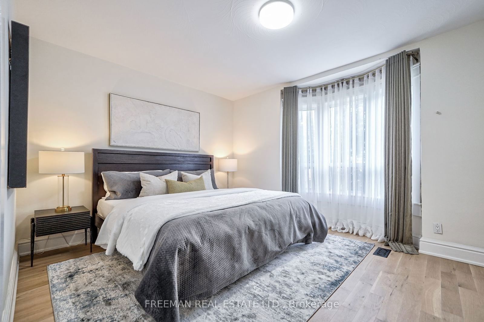 Image may contain Home Decor Corner Lamp Indoors Interior Design Bed Furniture Rug Bedroom and Room