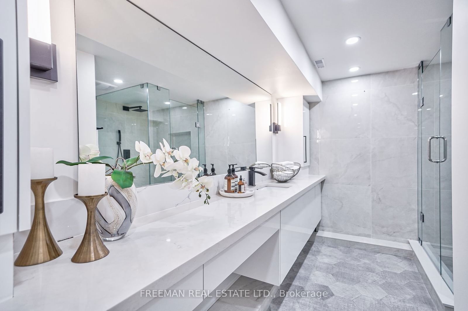 Image may contain Indoors Interior Design Candle Sink Sink Faucet Flower Flower Arrangement and Plant