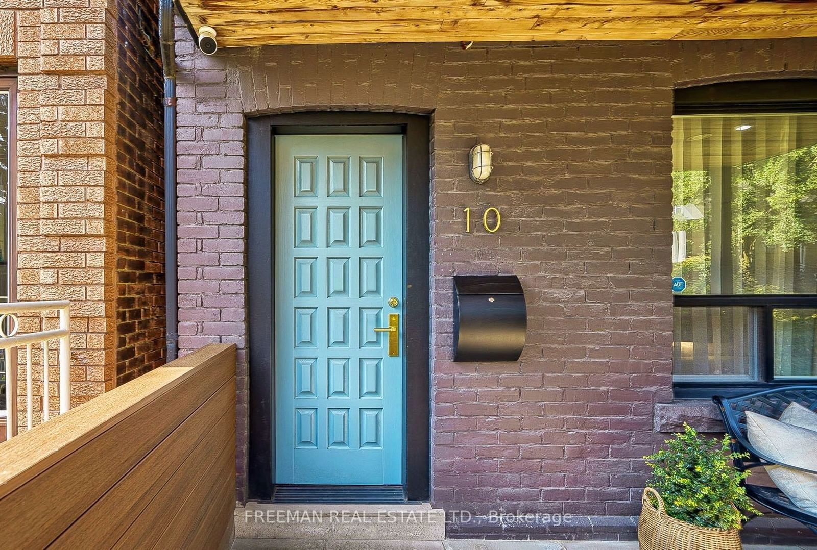 Image may contain Plant Lamp Indoors Interior Design Door Chair Furniture Wood Architecture Building and Housing