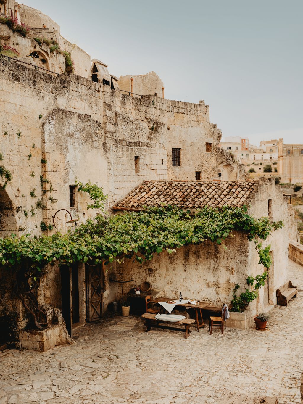 Image may contain Architecture Building Castle Fortress Chair Furniture Nature Outdoors Plant and Bench