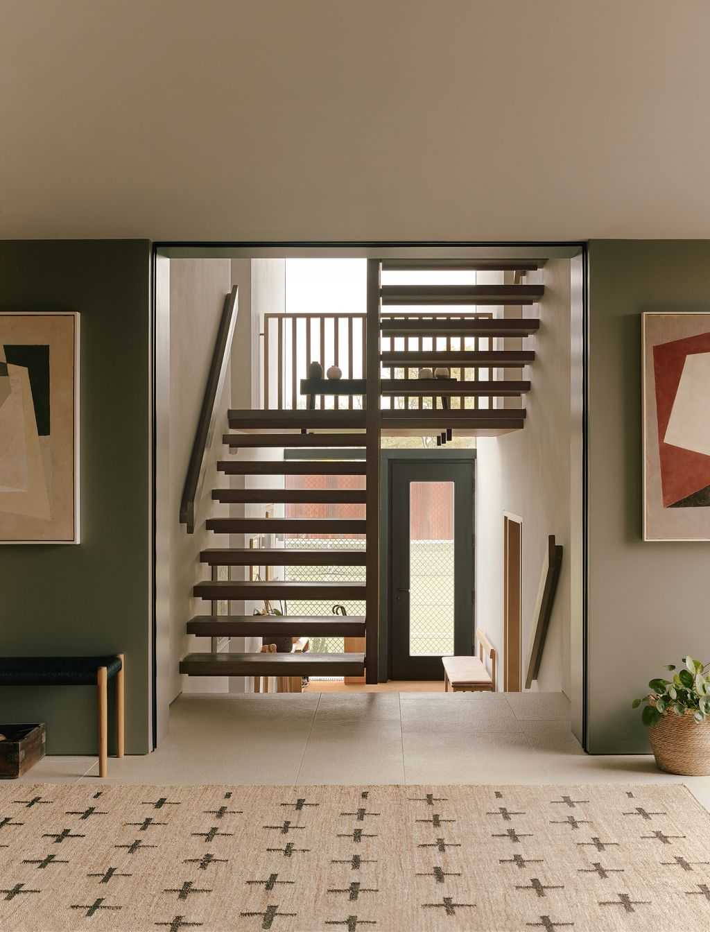 Image may contain Architecture Building House Housing Staircase Home Decor Rug Foyer Indoors Art Painting and Box