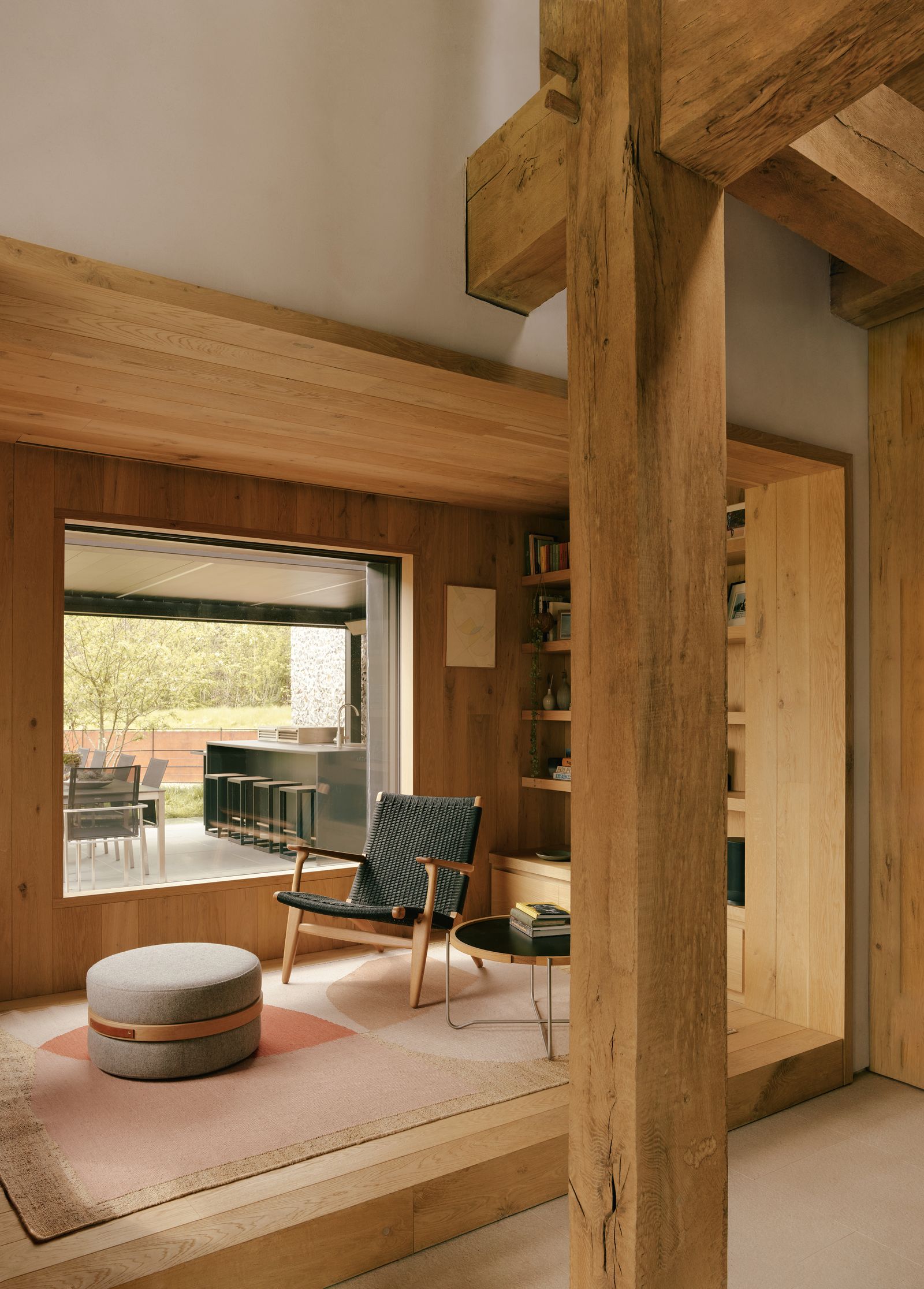 Image may contain Indoors Interior Design Wood Chair Furniture Architecture Building Living Room Room and Desk