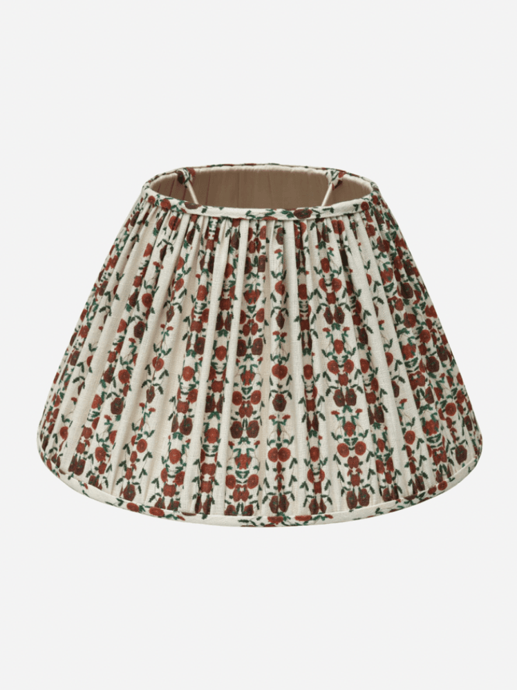 Image may contain: Lamp, Lampshade, Clothing, and Skirt