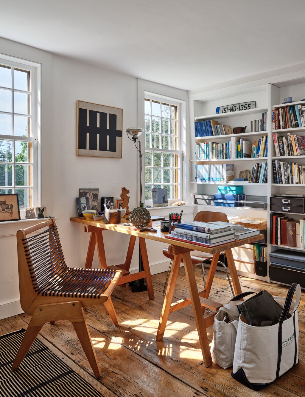 Image may contain Furniture Table Chair Desk Accessories Bag Handbag Art Painting Wood and Indoors