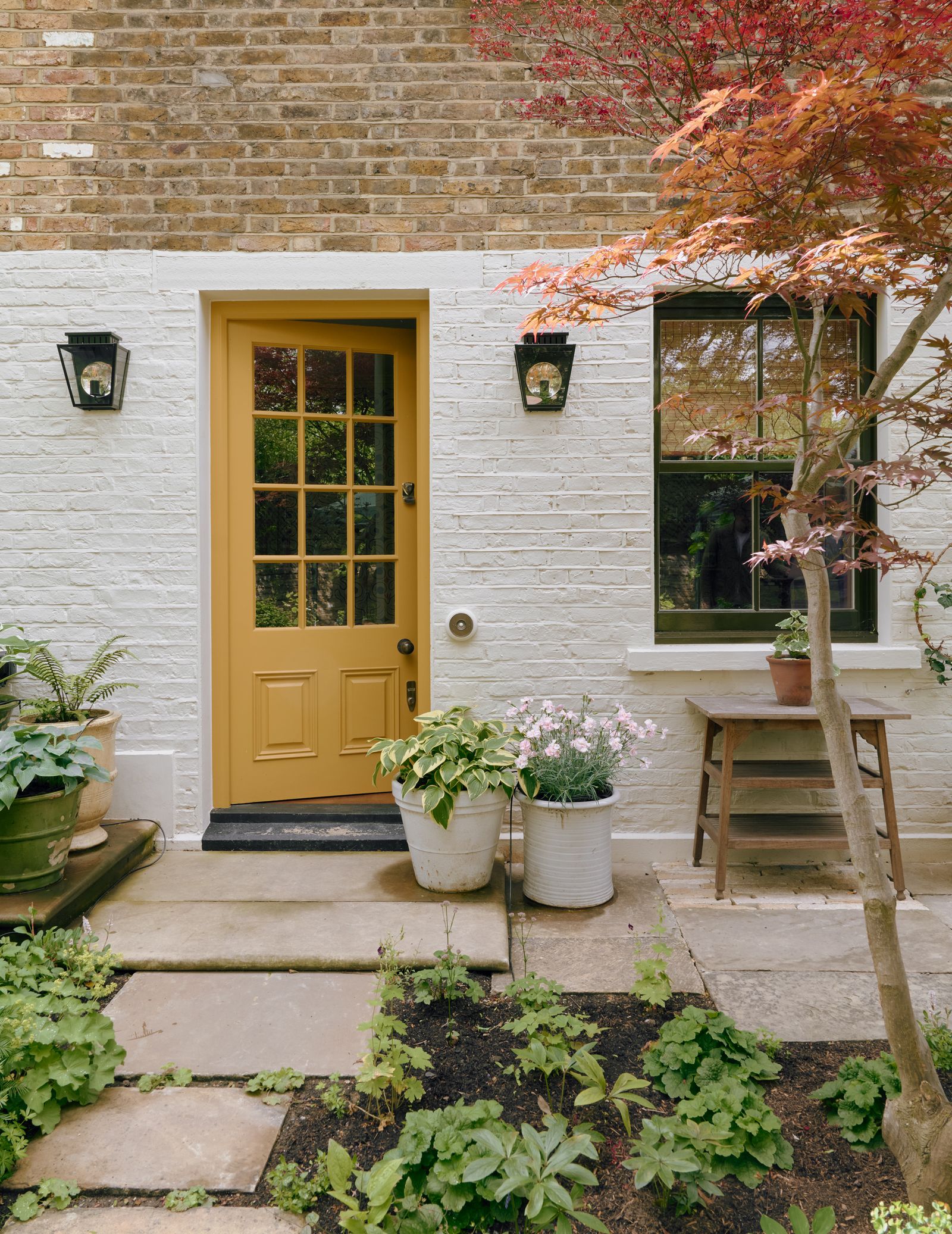 Image may contain Plant Potted Plant Jar Planter Pottery Vase Lamp Door Leaf Architecture Building and Housing