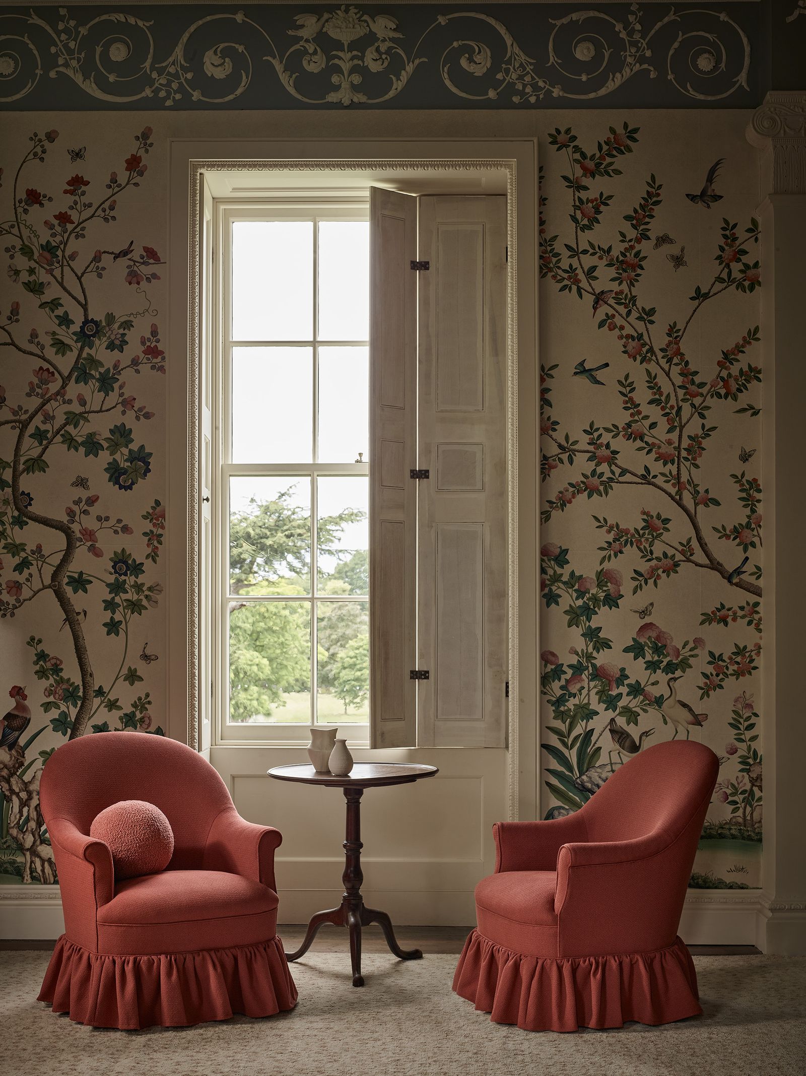 Image may contain Furniture Home Decor Chair Architecture Building Indoors Living Room Room Door and Armchair