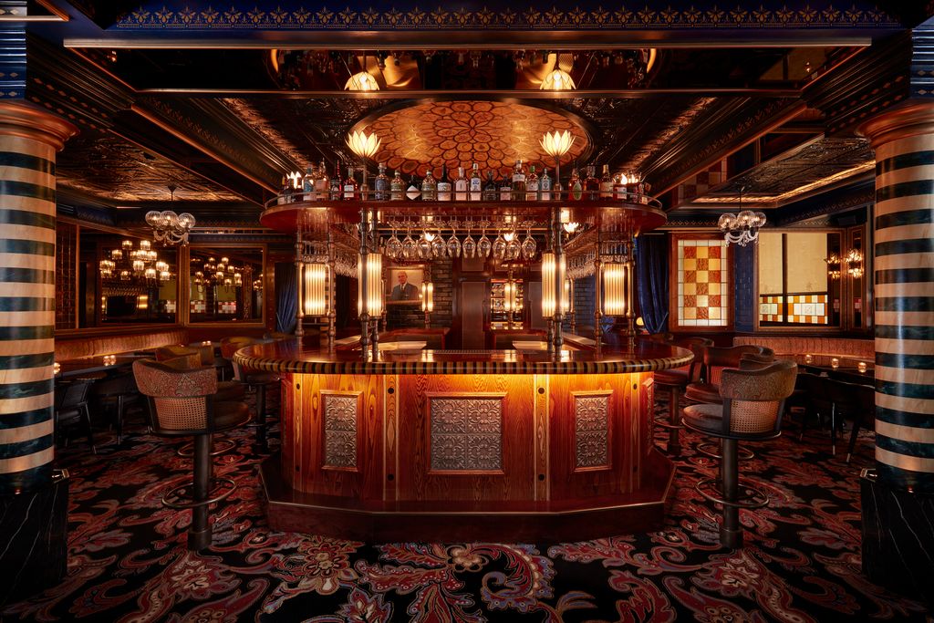 Image may contain Urban Bar Person Lamp Chair and Furniture