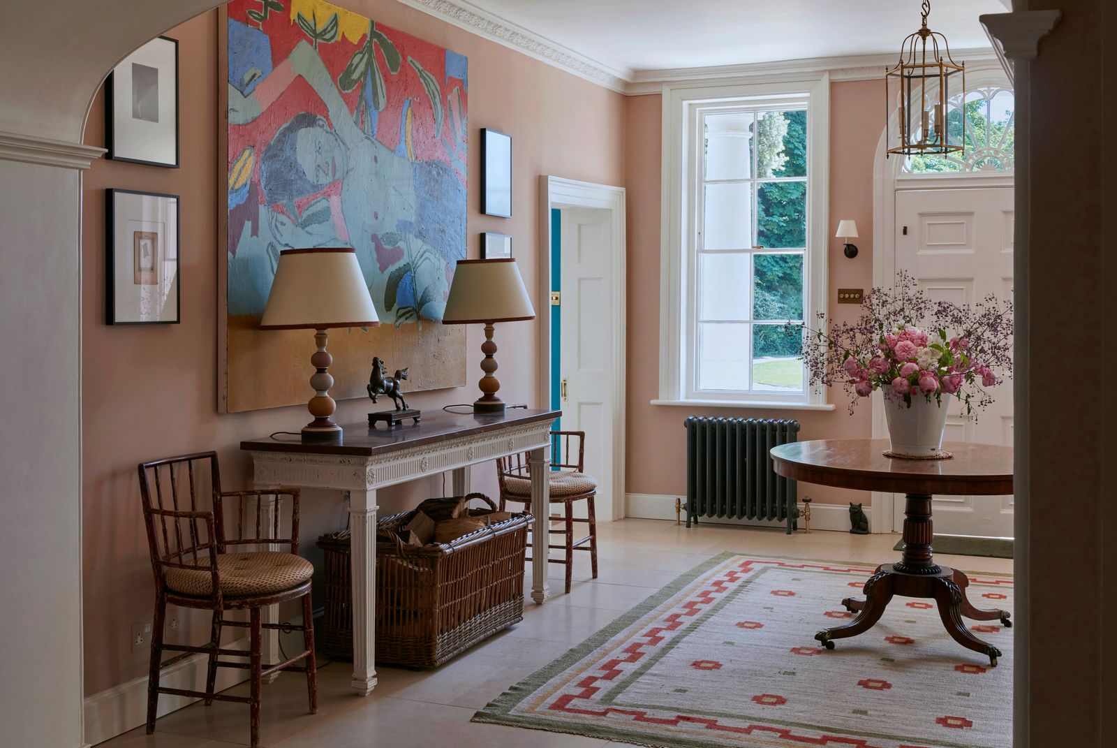 Image may contain Corner Lamp Home Decor Desk Furniture Table Rug Chair Indoors Interior Design and Dining Table