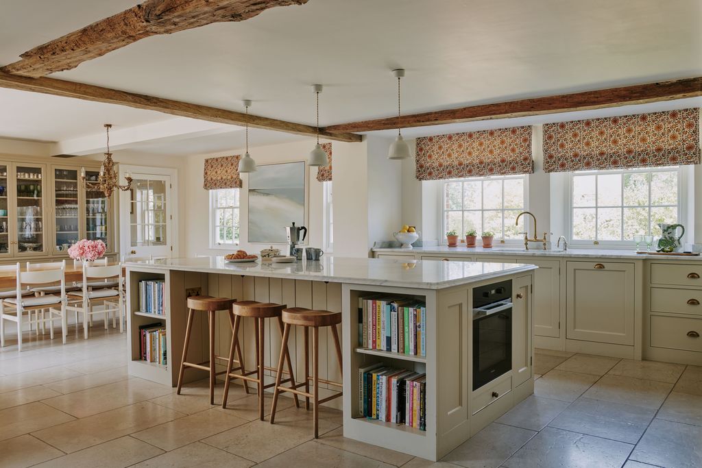 Image may contain Indoors Interior Design Kitchen Kitchen Island Furniture Dining Table Table and Architecture