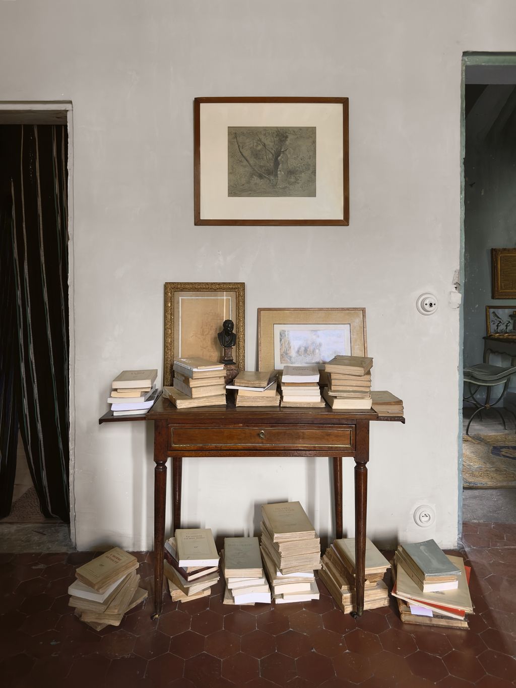 Image may contain Furniture Table Desk Book Publication Wood Art Painting Photo Frame Home Decor and Rug