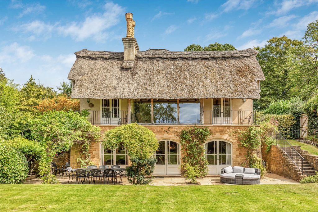 Image may contain Architecture Building Cottage House Housing Couch Furniture Manor and Chair