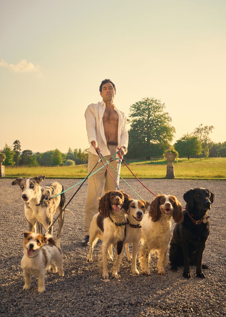 Image may contain: Alex Hassell, Adult, Person, Clothing, Footwear, Shoe, Animal, Canine, Dog, Mammal, Pet, and Walking