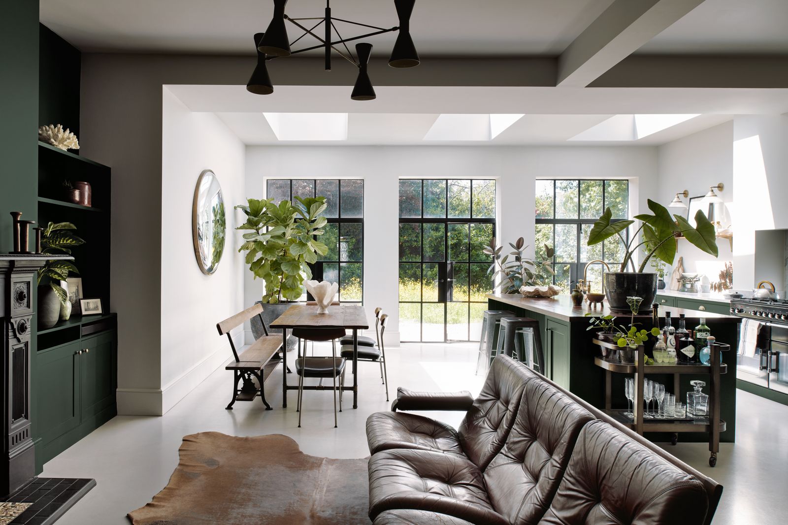 Image may contain Architecture Building Dining Room Dining Table Furniture Indoors Room Table Plant and Door