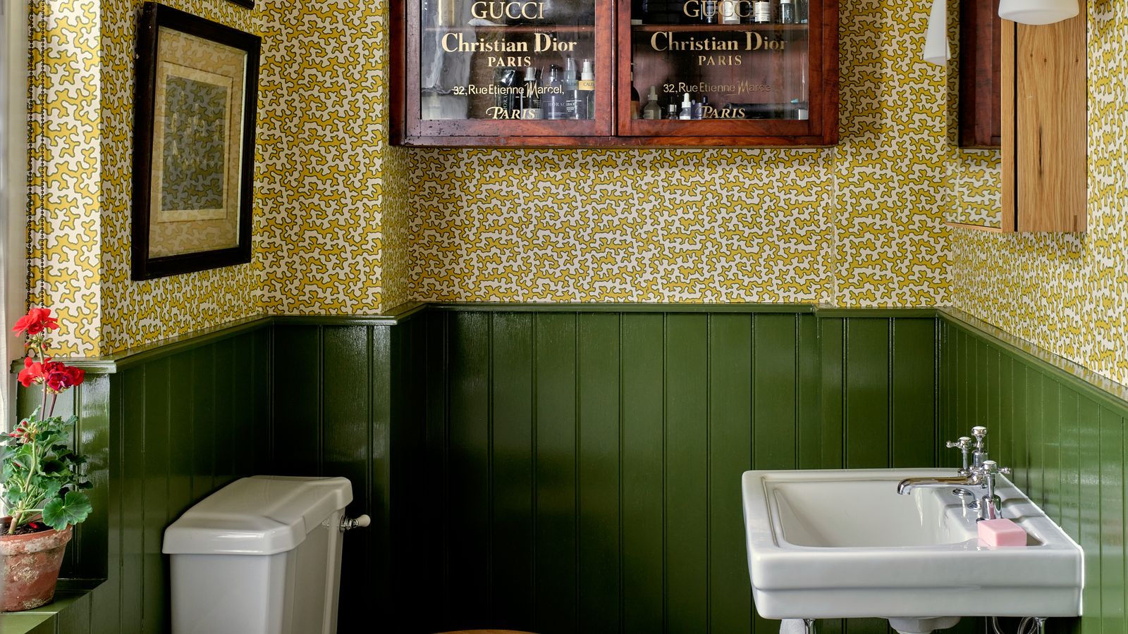 Image may contain: Lamp, Sink, Indoors, Interior Design, Art, Painting, Sink Faucet, Bathing, Bathtub, Person, and Tub