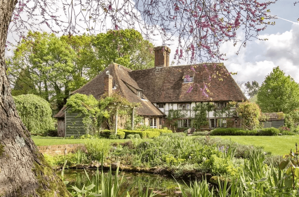 Image may contain Architecture Building Cottage House Housing Manor Outdoors Chair Furniture and Nature