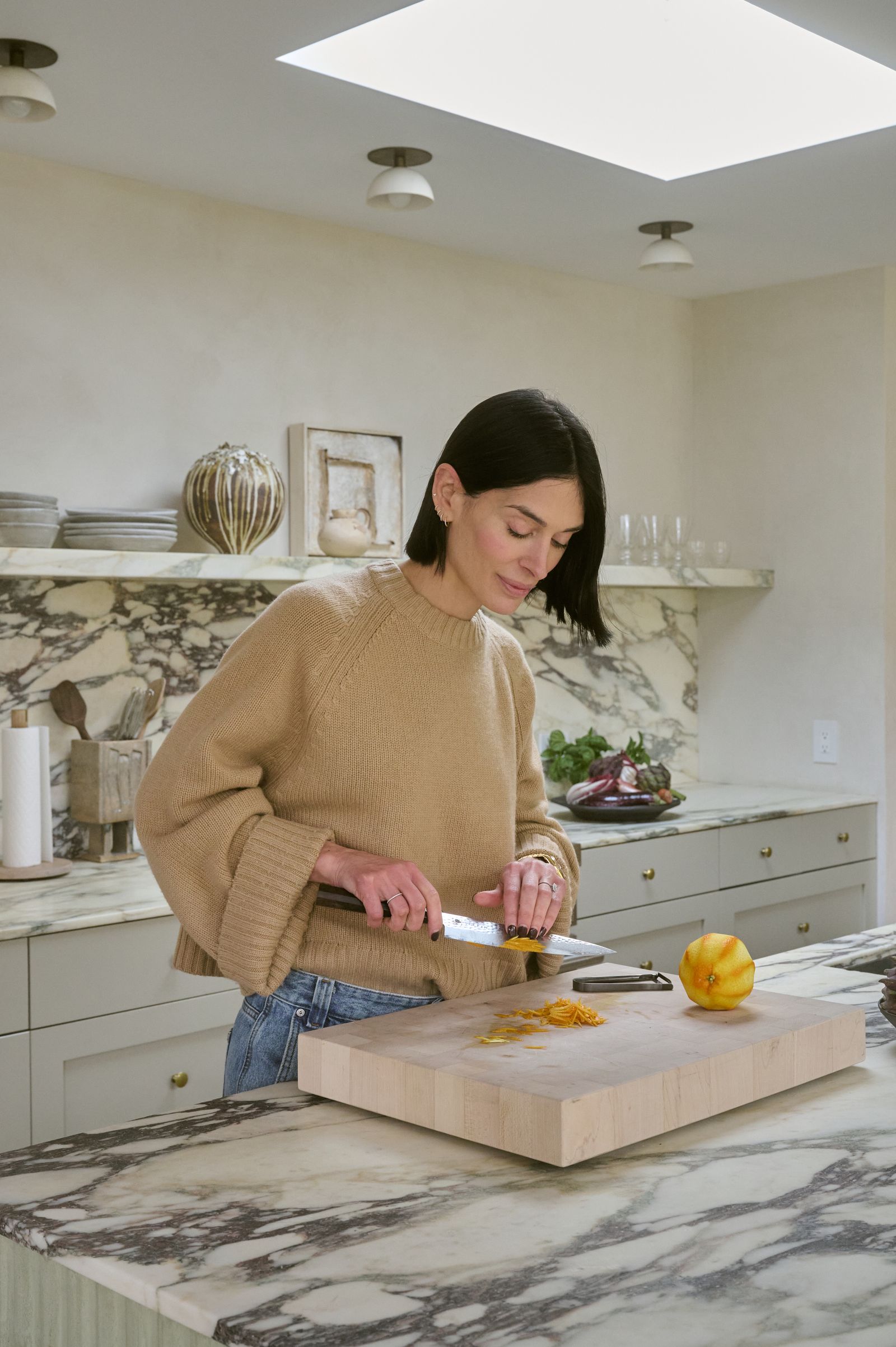 Image may contain Adult Person Blade Knife Weapon Chopping Board Food Lamp Art Painting and Chopping Ingredients