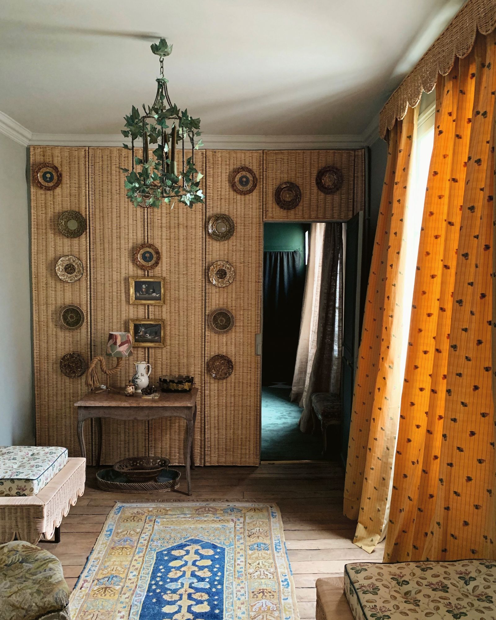 Image may contain Indoors Interior Design Home Decor Rug Chandelier Lamp Desk Furniture Table and Dressing Room