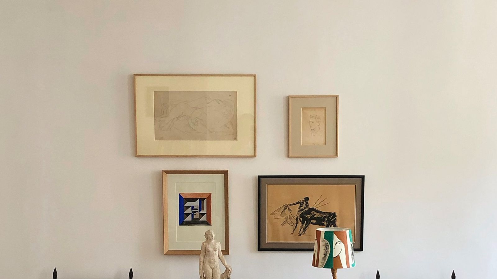 Image may contain: Indoors, Interior Design, Furniture, Table, Chair, Desk, Art, Painting, Hardwood, Stained Wood, and Wood