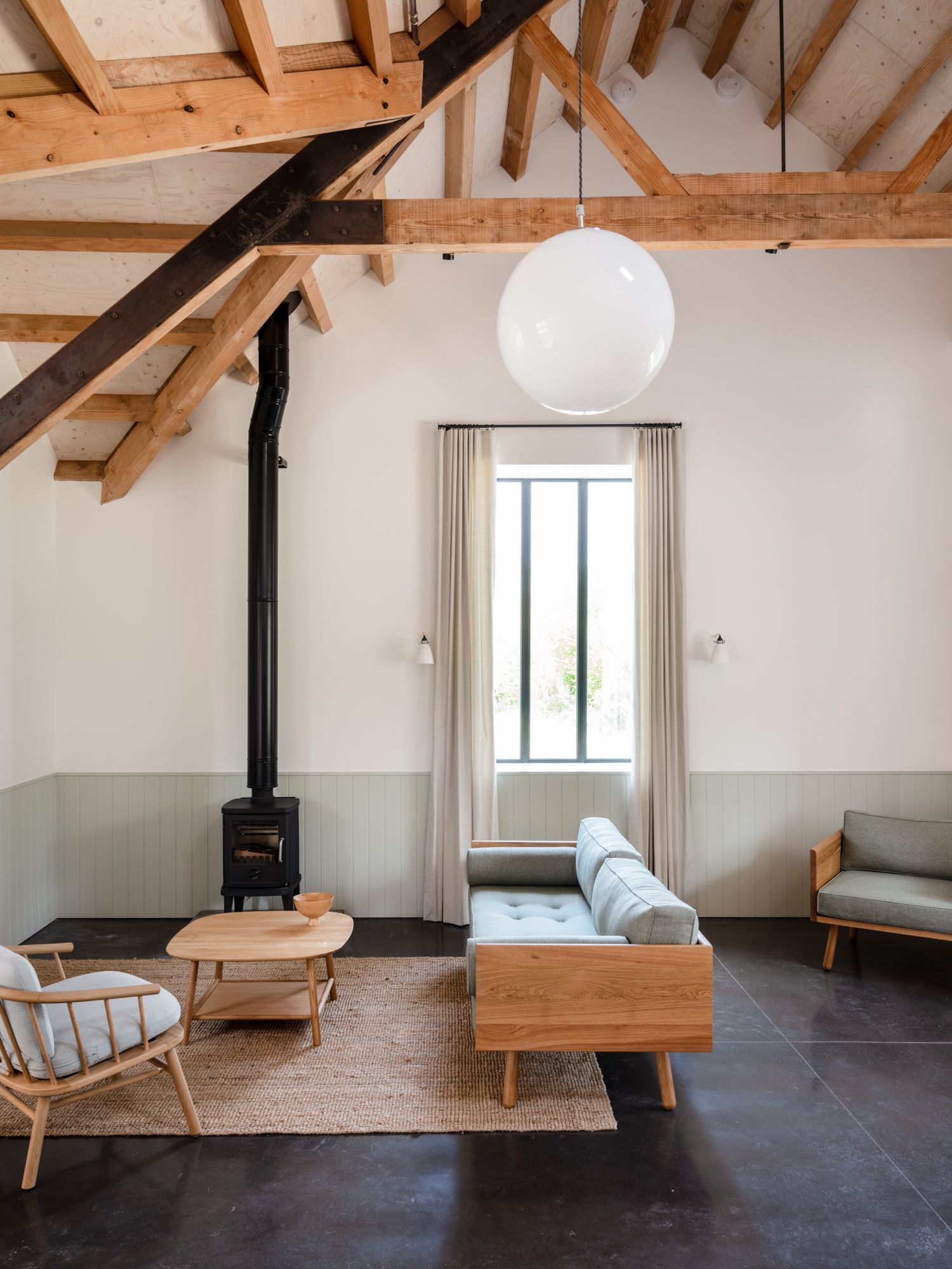 Image may contain Indoors Interior Design Architecture Building Furniture Living Room Room Chair Home Decor and Rug