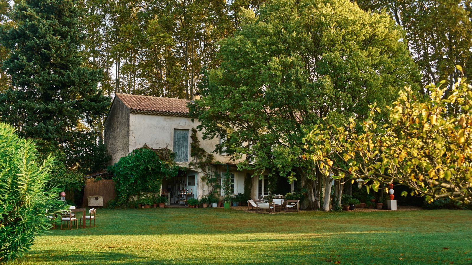 Image may contain: Grass, Plant, Lawn, Architecture, Building, Cottage, House, Housing, Villa, Chair, Furniture, and Nature