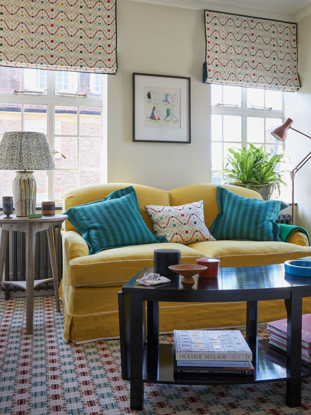 Image may contain Couch Furniture Architecture Building Indoors Living Room Room Home Decor Coffee Table and Table