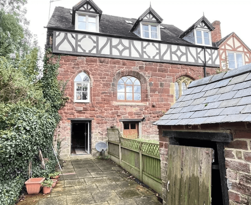 Image may contain Architecture Building Housing Outdoors House Indoors Interior Design Arch Gothic Arch and Plant