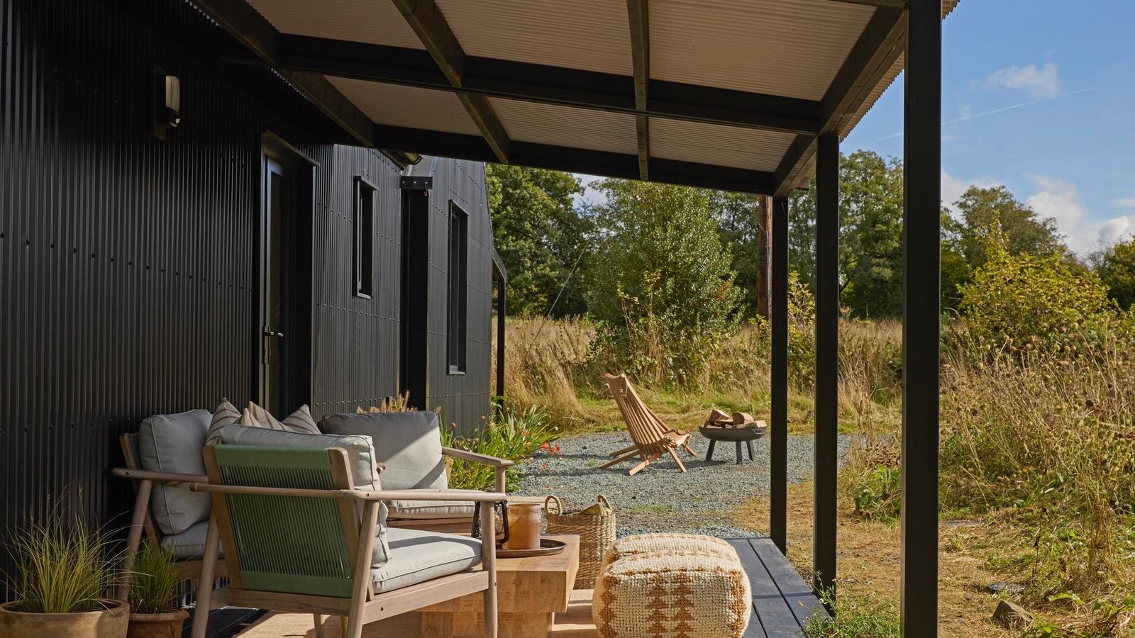 Image may contain Indoors Interior Design Architecture Building House Housing Porch Chair Furniture and Patio