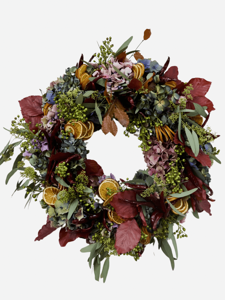 Image may contain: Plant, Wreath, Flower, and Flower Arrangement