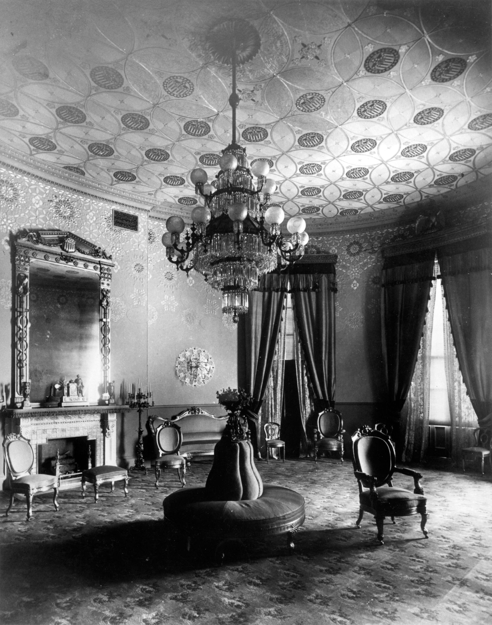 Image may contain Chandelier Lamp Architecture Building Furniture Indoors Living Room Room and Reception