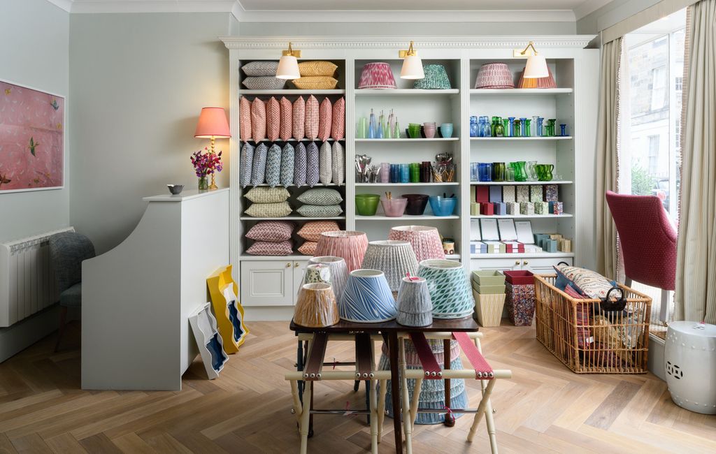 Image may contain Home Decor Desk Furniture Table Cup Chair Lamp Indoors Interior Design Accessories and Bag