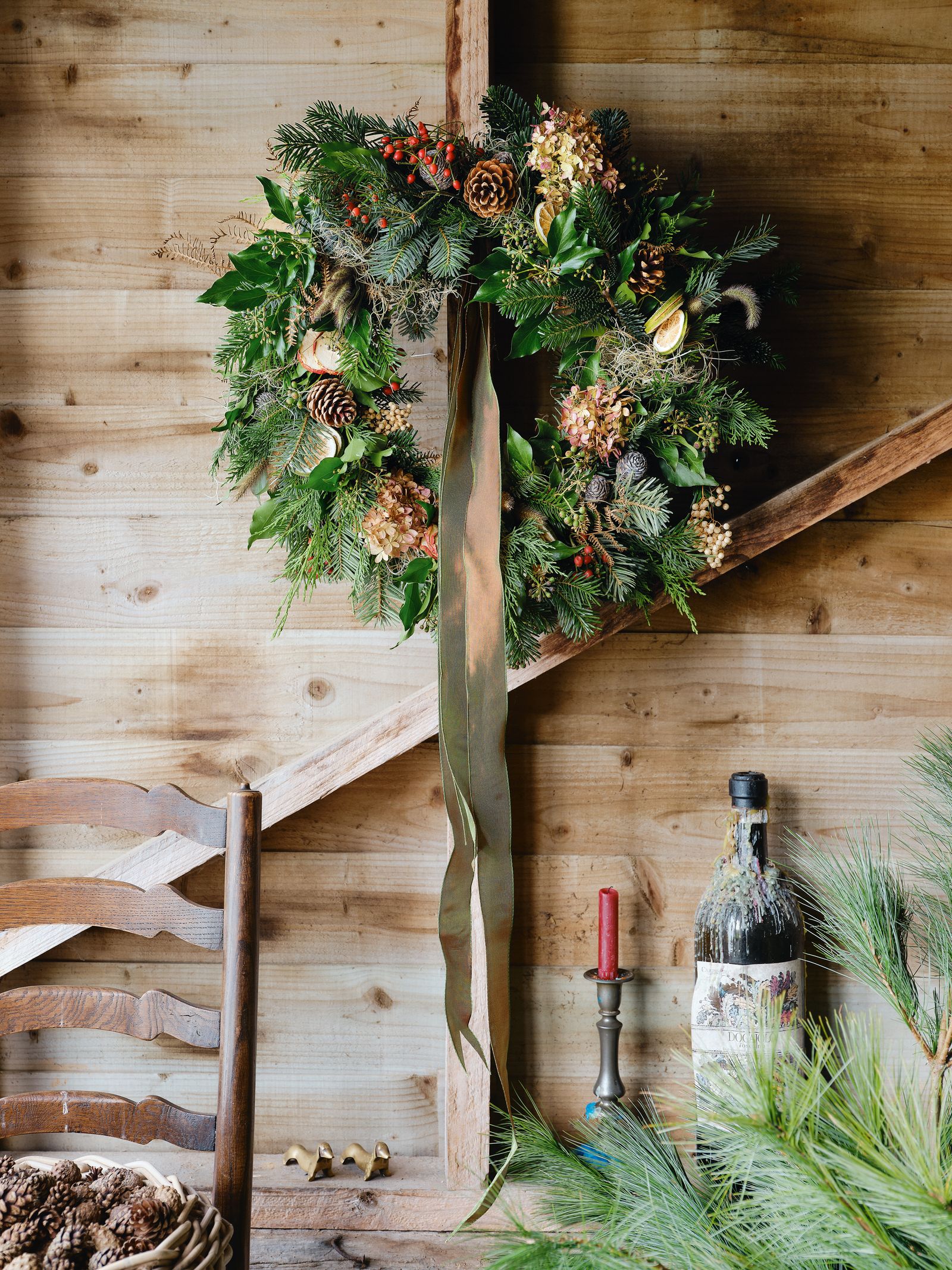Image may contain Chair Furniture Cross Symbol Candle Flower Plant and Flower Arrangement