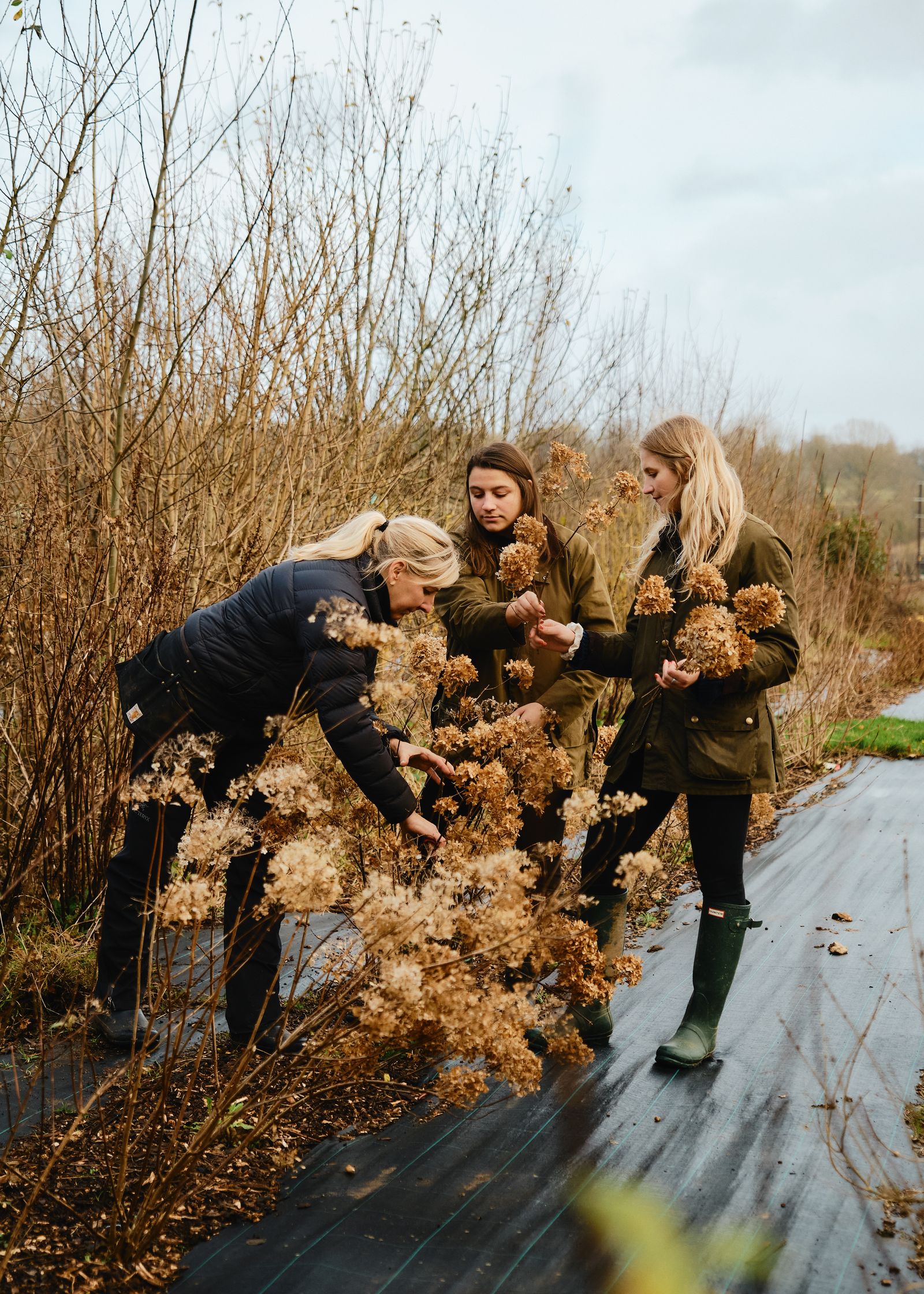 Image may contain Dominique Dupuis Clothing Footwear Shoe Plant Vegetation Adult Person Photography Coat and Face