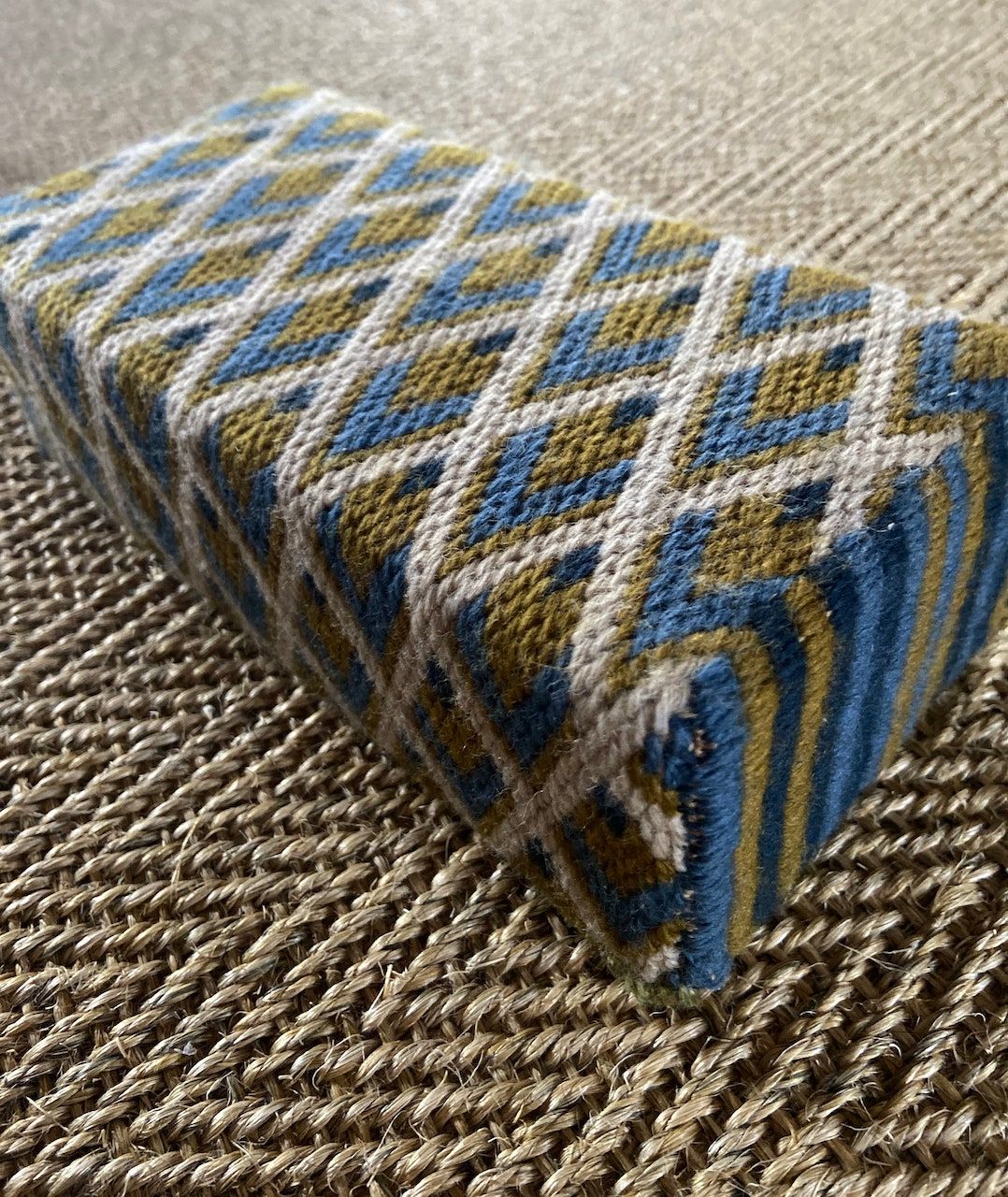 Image may contain Home Decor Rug Cushion and Pillow