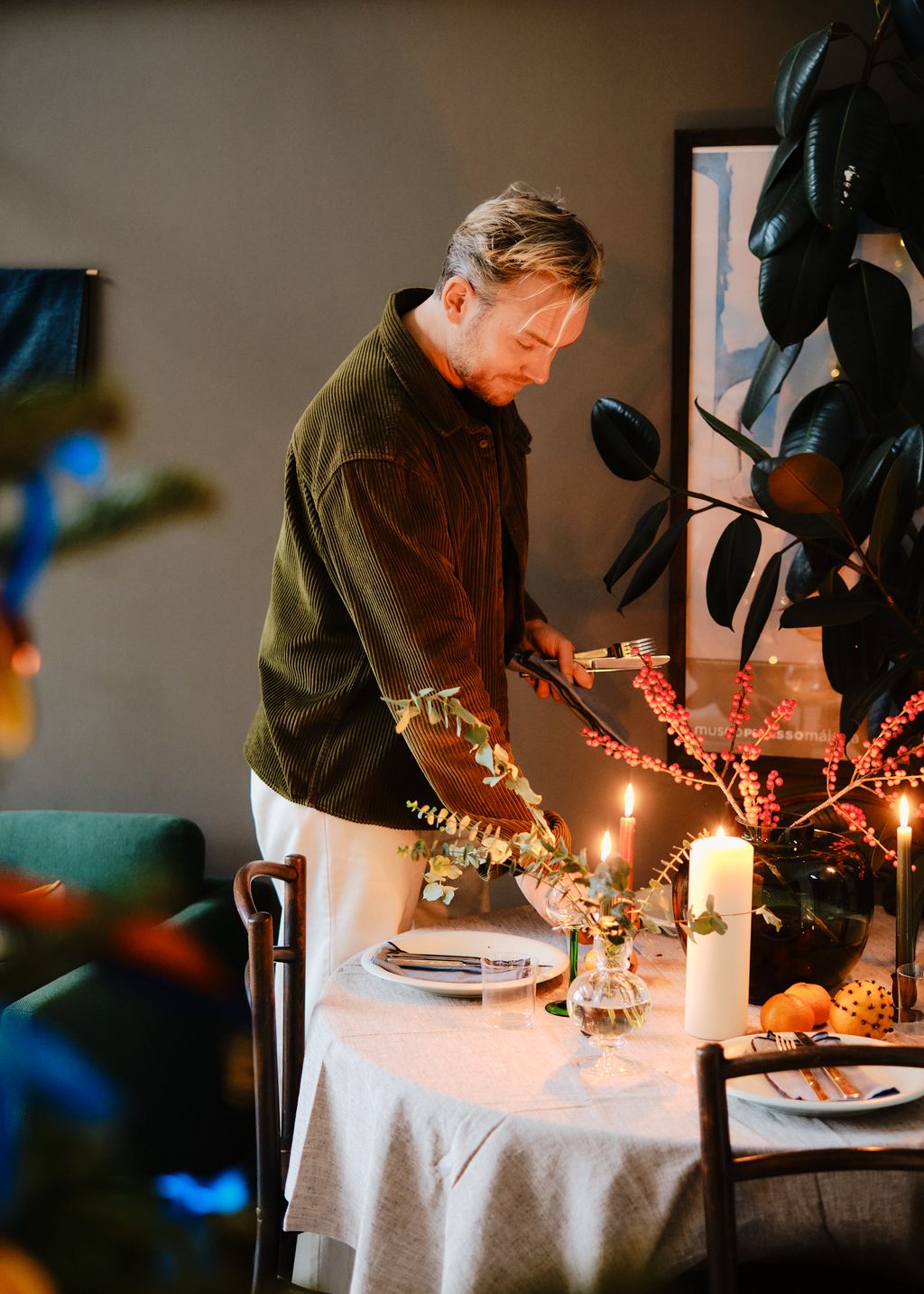 Image may contain Plate Cup Adult Person Chair Furniture Candle and Table