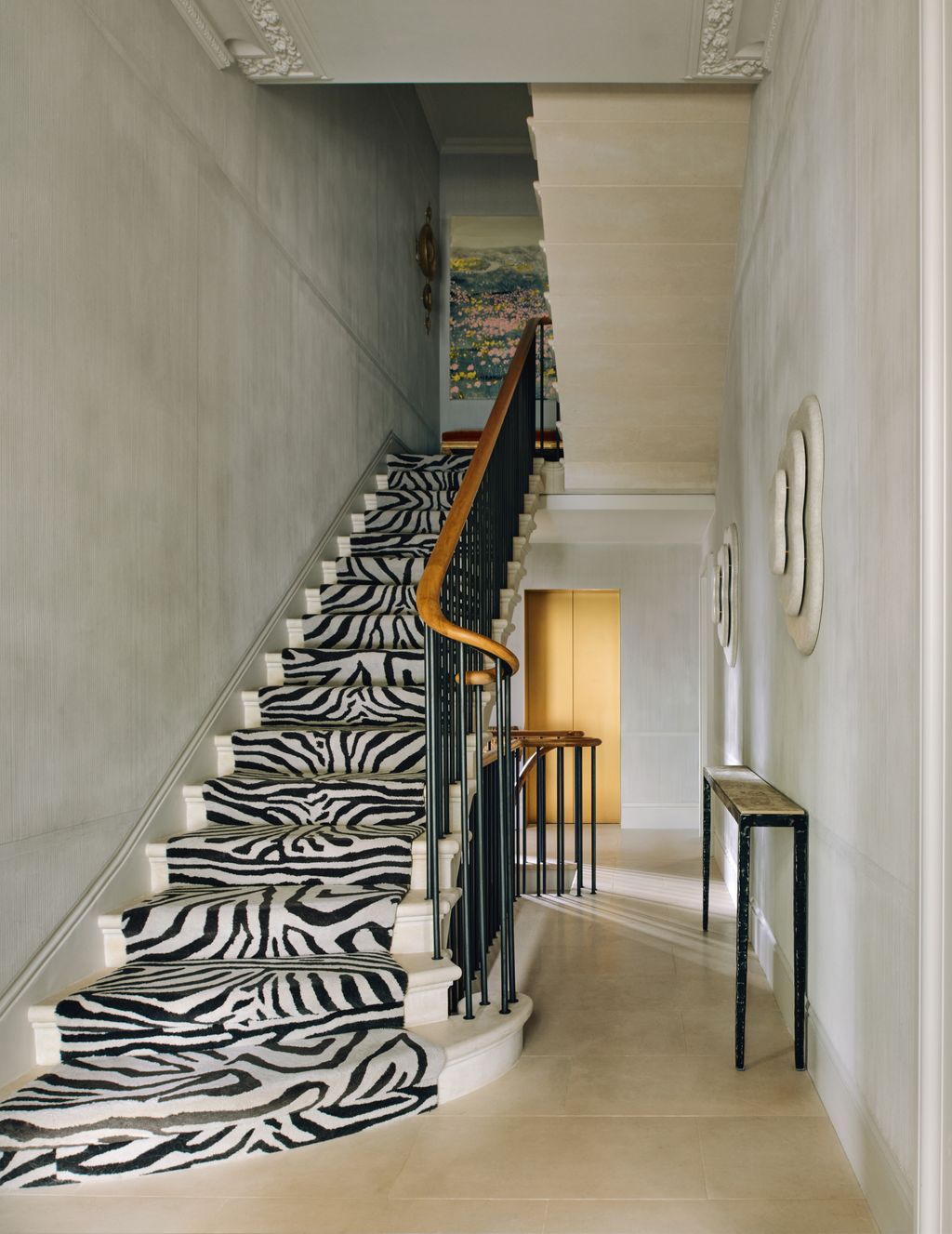 Image may contain Architecture Building House Housing Staircase Indoors Foyer Desk Furniture and Table