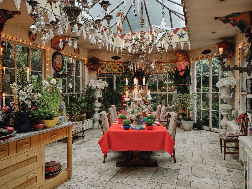 Image may contain Plant Chair Furniture Candle Architecture Building Dining Room Dining Table Indoors and Room