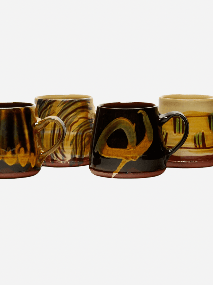 Image may contain: Pottery, Cup, Beverage, Coffee, and Coffee Cup