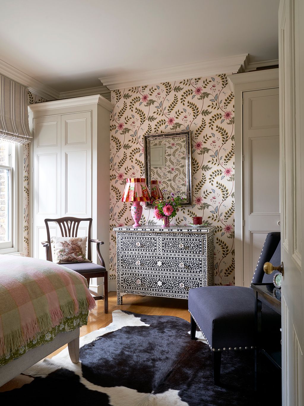 Image may contain Home Decor Chair Furniture Lamp Rug Bed Art Painting Bedroom Indoors Room and Cup