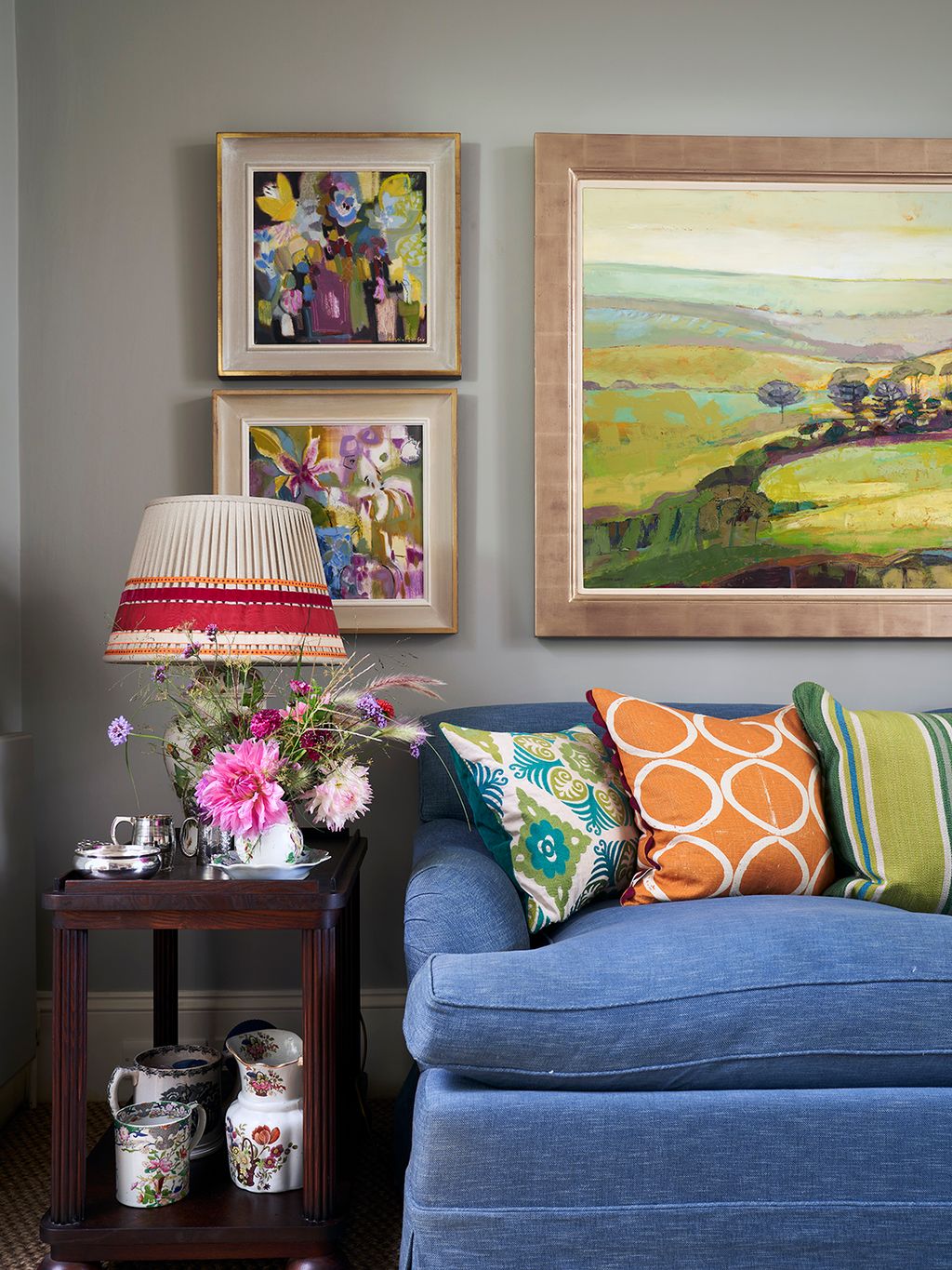 Image may contain Cushion Home Decor Art Painting Lamp Pillow Couch Furniture Indoors Interior Design and Cup