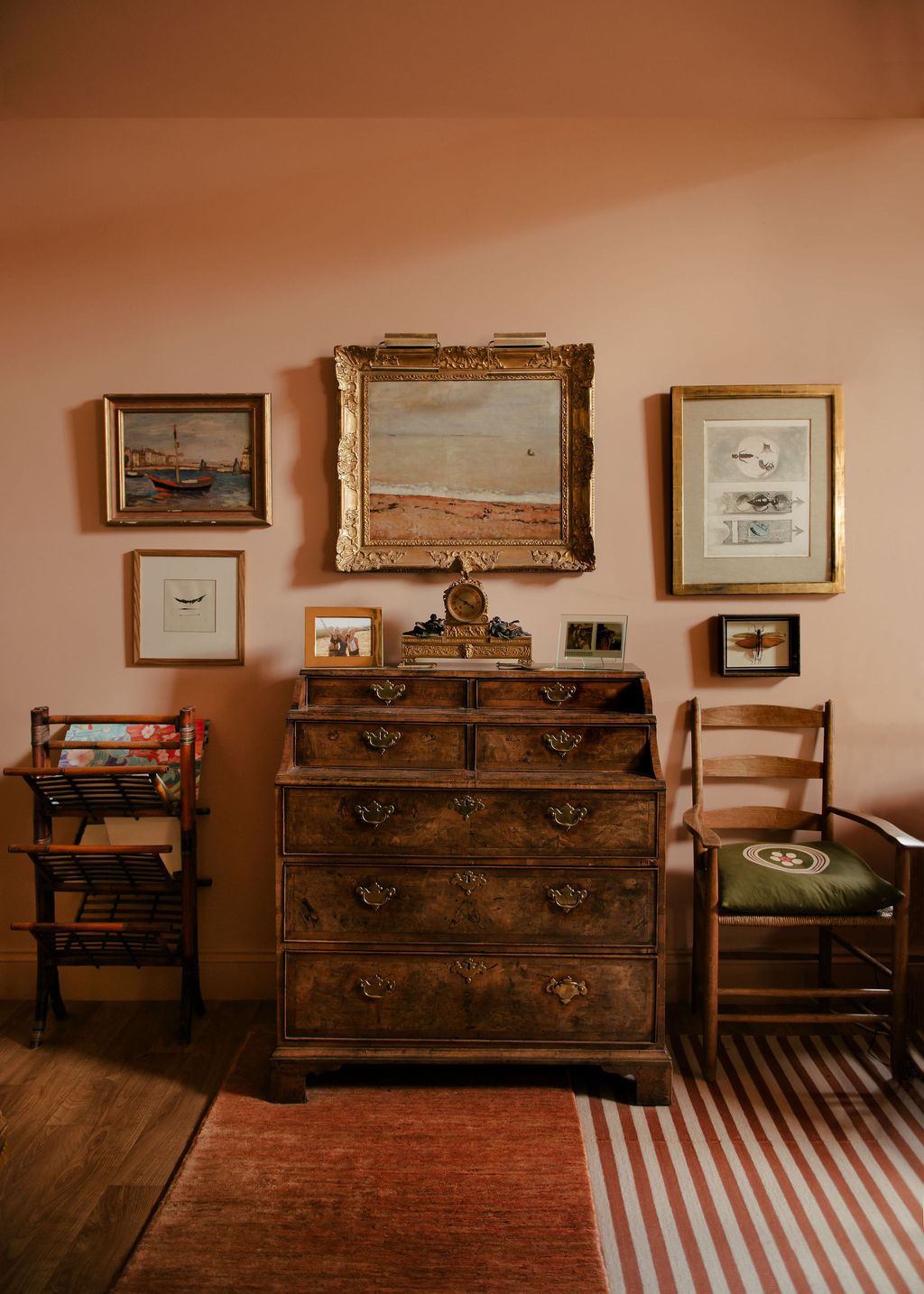 Image may contain Furniture Chair Art Painting Cabinet Home Decor Rug and Person