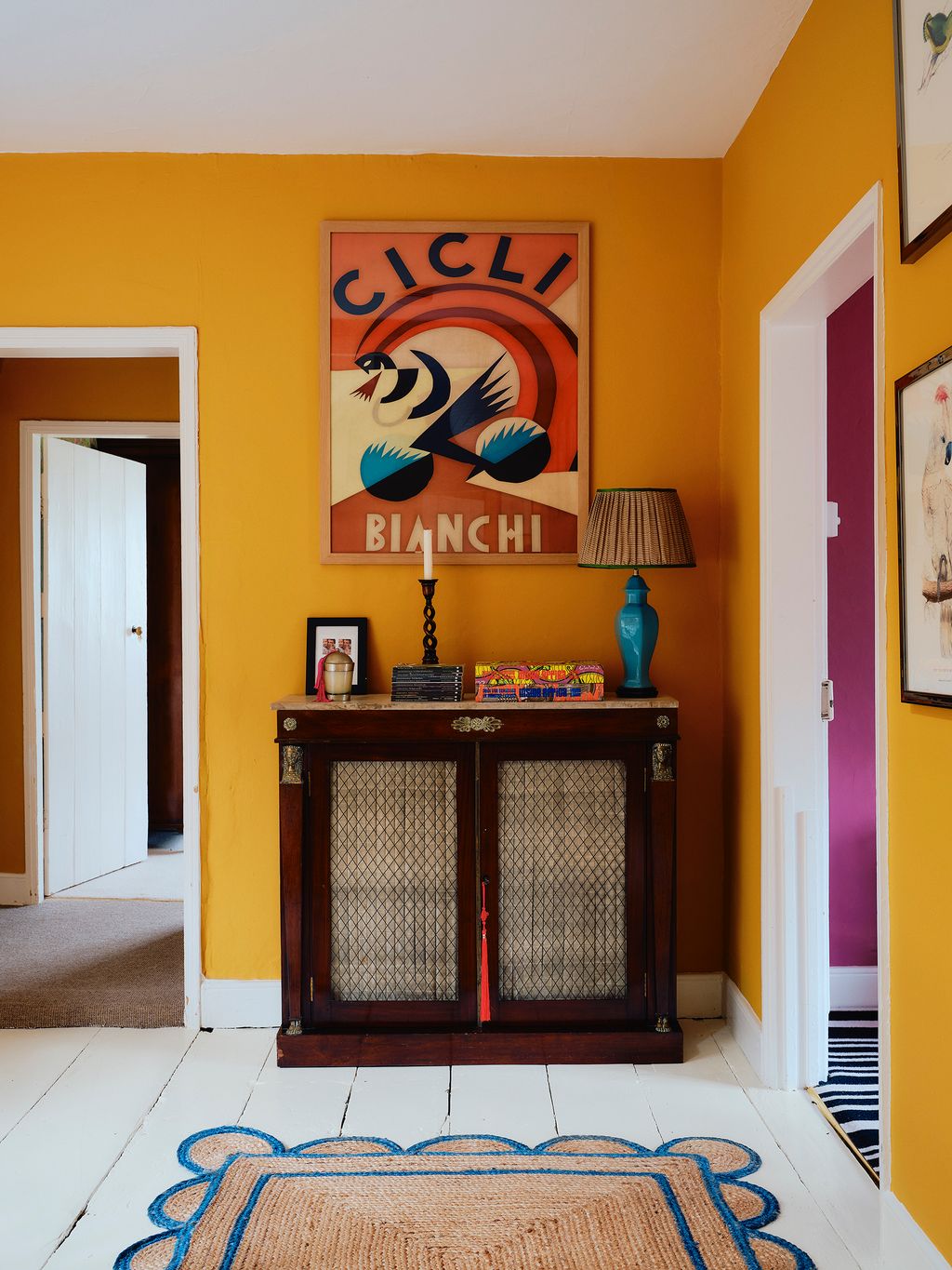 Image may contain Corner Home Decor Lamp Indoors Interior Design Rug Art Painting Floor Flooring and Architecture