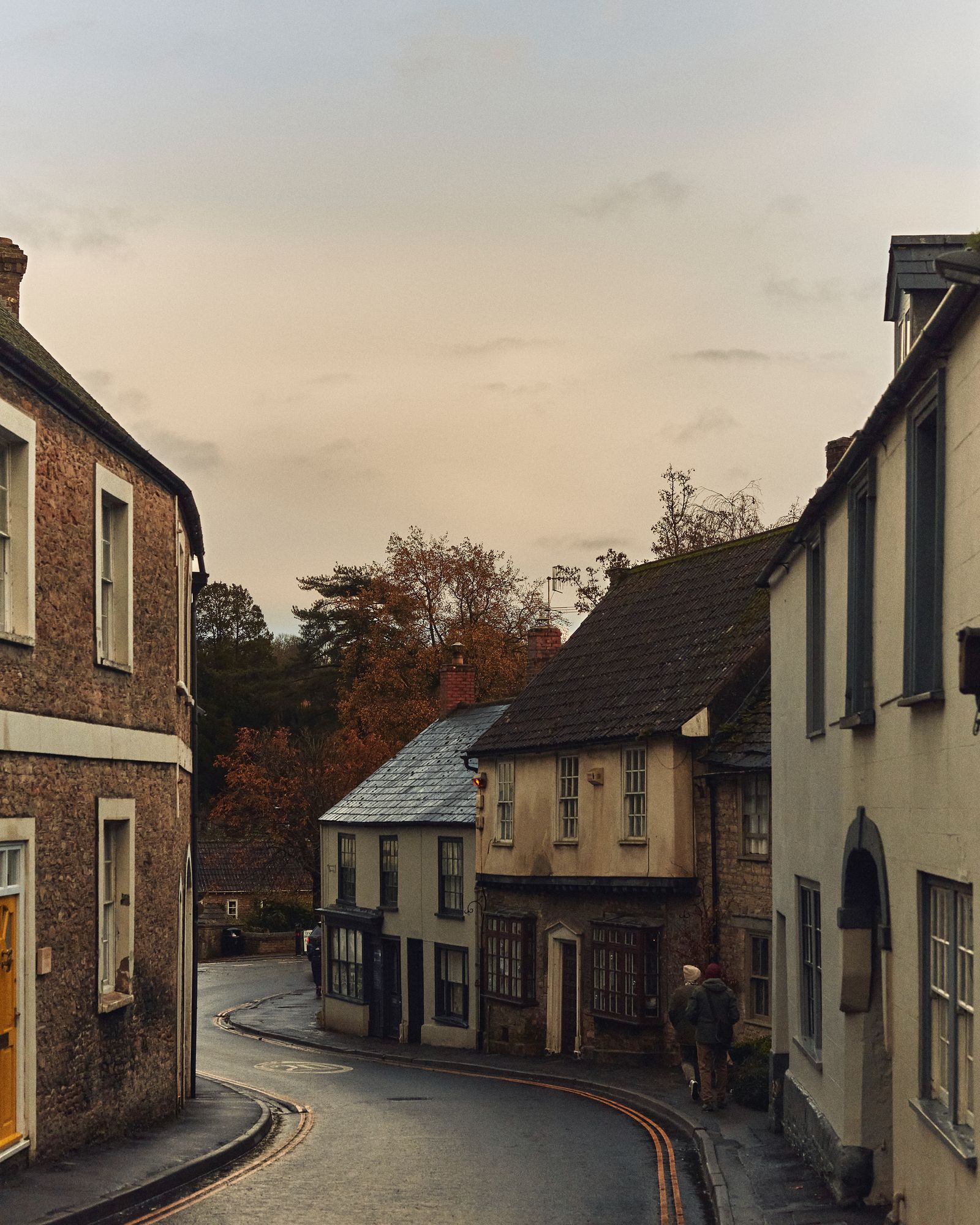 Image may contain City Road Street Urban Neighborhood Tarmac Alley Person Architecture Building Housing and House