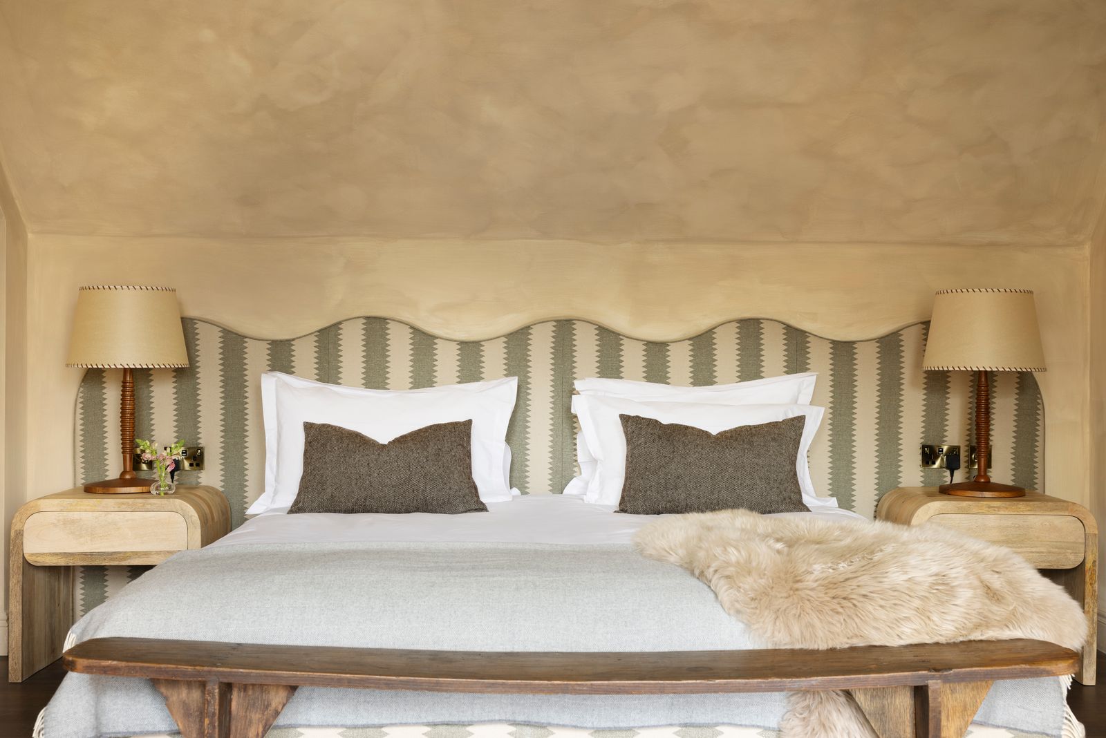 Image may contain Cushion Home Decor Lamp Table Lamp Pillow Bed Furniture Indoors Interior Design Bedroom and Room