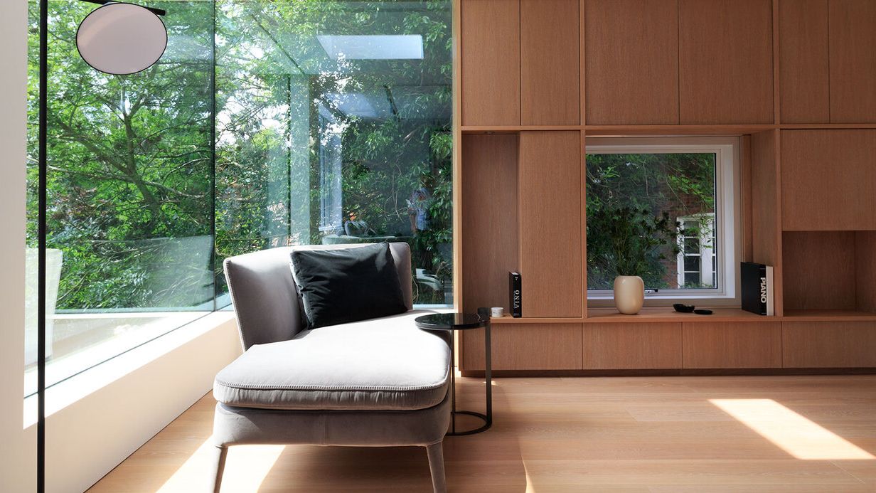 Image may contain: Indoors, Interior Design, Chair, Furniture, Desk, Table, Window, Door, Cup, Person, and Home Decor