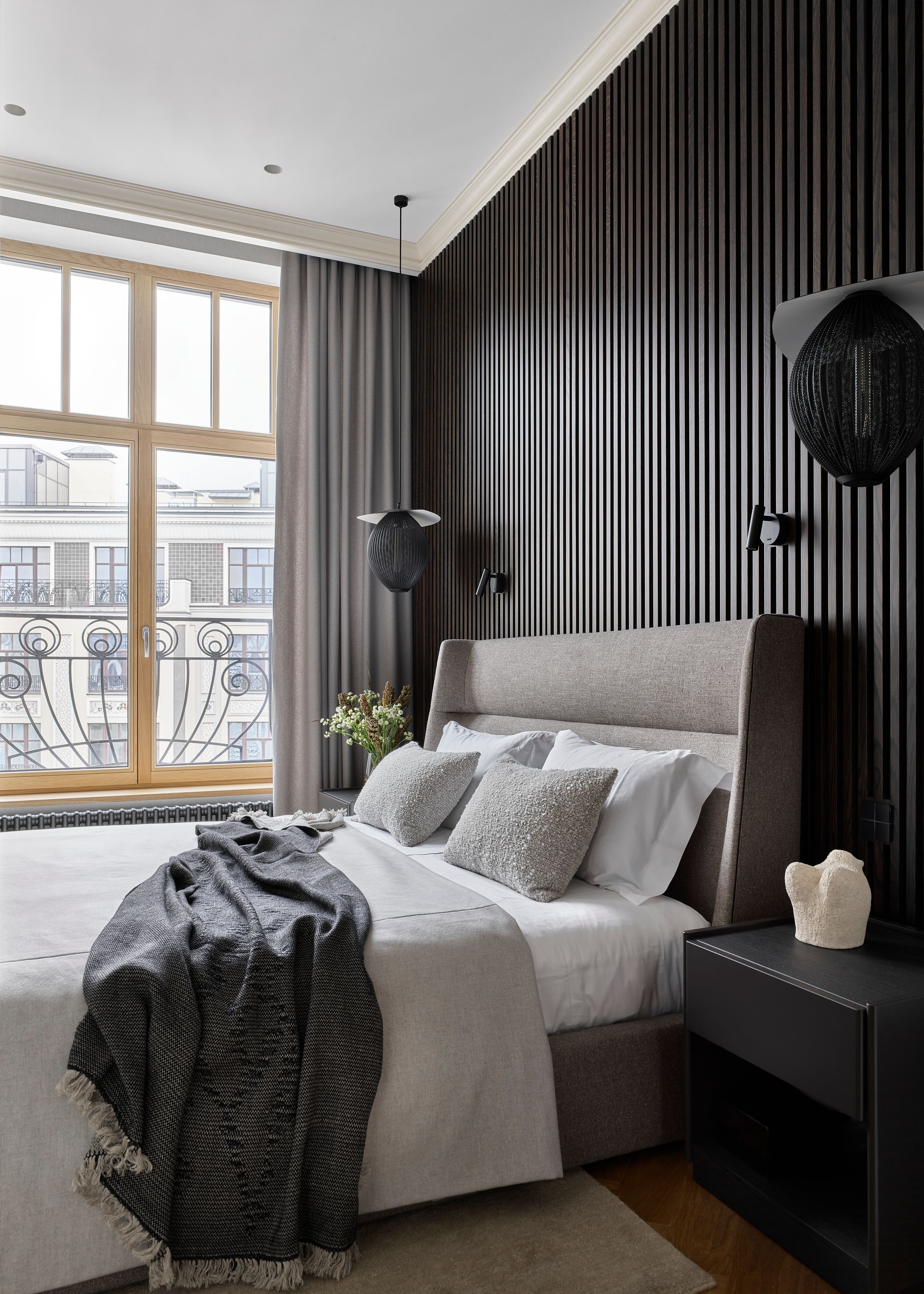 Image may contain: Indoors, Interior Design, Wood Panels, Bed, Furniture, and Lamp