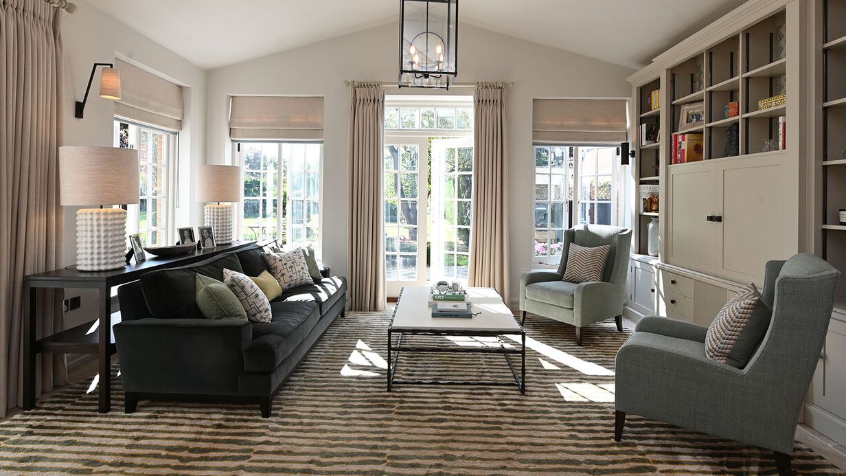 Image may contain: Door, Home Decor, Lamp, Couch, Furniture, Chair, Architecture, Building, Indoors, Living Room, and Room