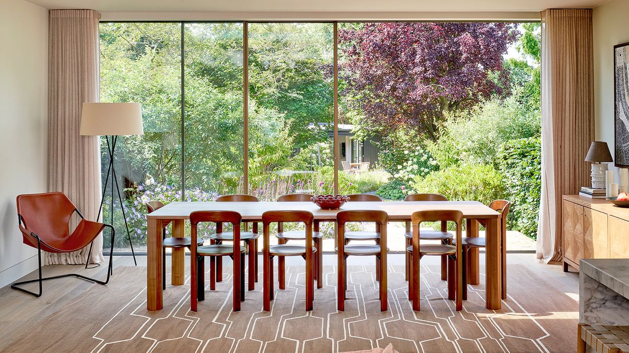 Image may contain: Architecture, Building, Dining Room, Dining Table, Furniture, Indoors, Room, Table, Chair, and Lamp