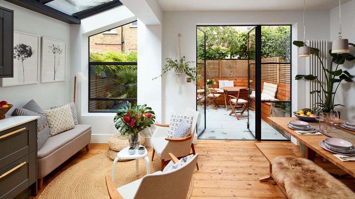 Image may contain: Home Decor, Indoors, Interior Design, Chair, Furniture, Lamp, Architecture, Building, and Dining Room